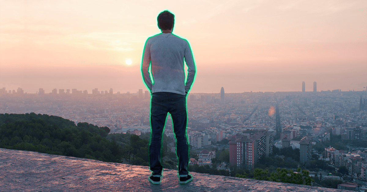 Man standing over city skyline